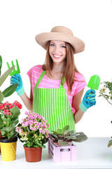 Beautiful girl gardener with flowers isolated on white