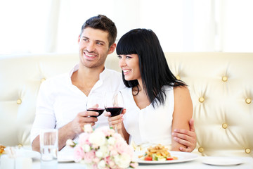 Beautiful couple having  romantic dinner at restaurant