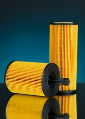 Car oil filters on dark color background