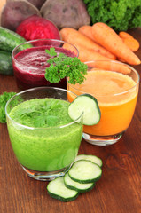 Fresh vegetable juices on table close-up