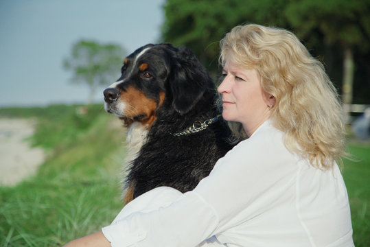 dog and woman sitting