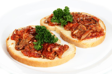 Tasty sandwiches with sardines  and tomato sauce, close-up