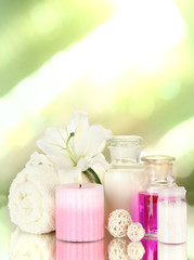 Beautiful spa setting with lily on bright background