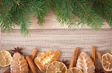 Obraz na płótnie Canvas Christmas decoration with fir-tree on wooden background