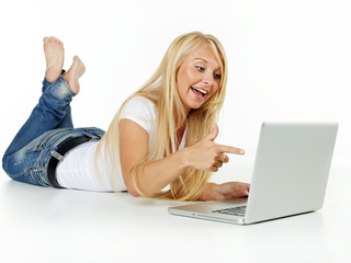 Surprised woman pointing at her laptop