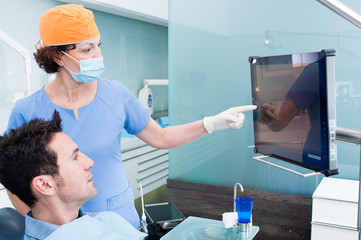 The dentist and the patient commenting about medical treatment
