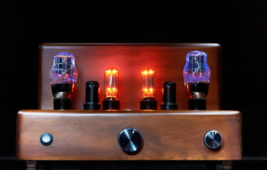 electronic amplifier with glowing bulb lamp