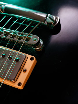 Electric guitar strings and bridge closeup