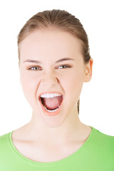 Young casual woman screaming with anger