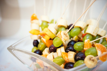 pieces of fruit on the stick ready for chocolate fondue bath