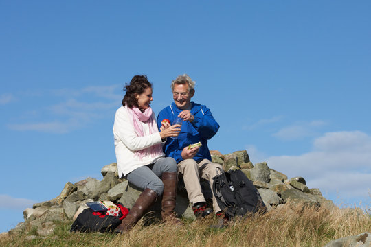 Senior Couple Stopping For Lunch On Countryside Walk - Powered by Adobe