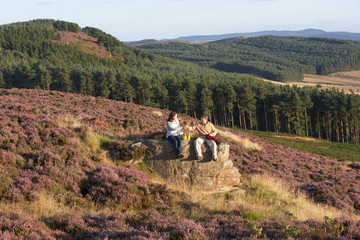 Fototapeta na wymiar Couple Stopping For Lunch On Countryside Walk