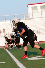 Young american football player as wide receiver