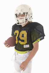 Boy holding American football