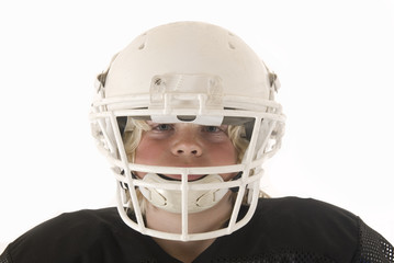 Boy in American football helmet