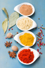 colorful spices on blue  table