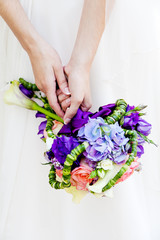 Bride holding bridal bouquet.