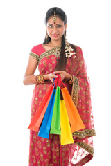 Indian woman holding shopping bags