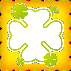 Marienkäfer mit Kleeblätter auf orangenem Hintergrund