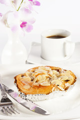 Delicious danish pastry with a cup of black coffee