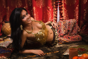 Beautiful woman in the arabic harem interior