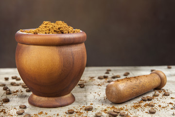 Mortar and pestle with brown coffee