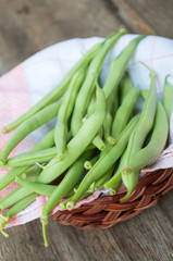 Green beans on a wooden table