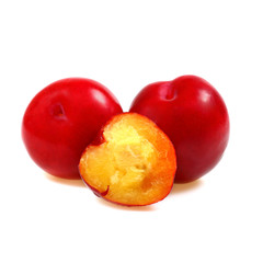 Two plums with a half