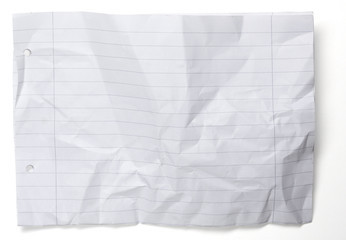 crumpled paper with lines and holes isolated on white