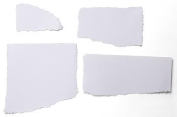 collection of white ripped pieces of paper isolated on white
