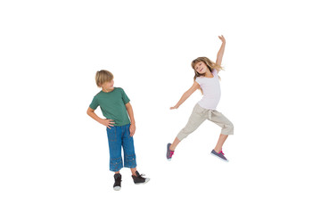 Fototapeta na wymiar Happy little boy and girl jumping