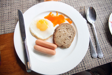 Sausage egg bread in white dish.