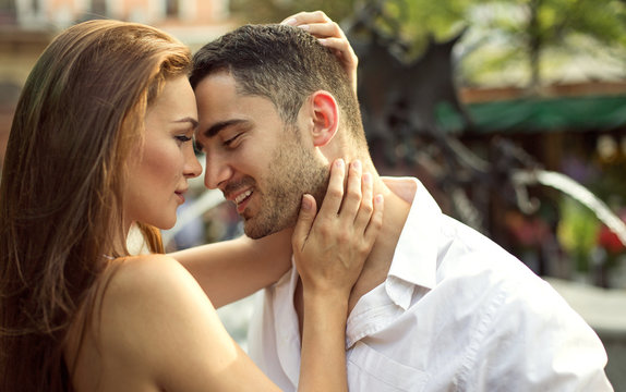 Smiling couple kissing each other