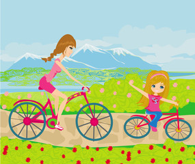 Obraz premium Mother and daughter biking in the park