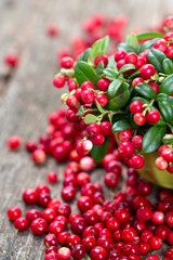 cowberries on wooden surface