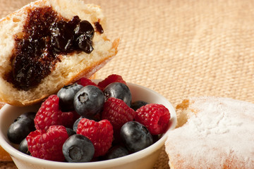 donut with berries and jam