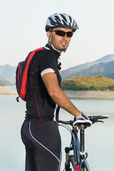 Mountain biker beside a beautiful lake