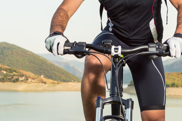 Mountain biker beside a beautiful lake