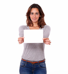 Charming young woman holding a blank card