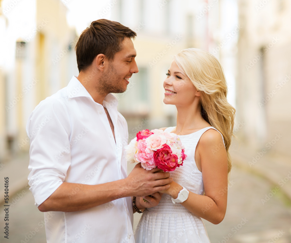 Poster couple with flowers in the city