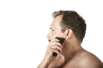 Man shaving face with electric razor