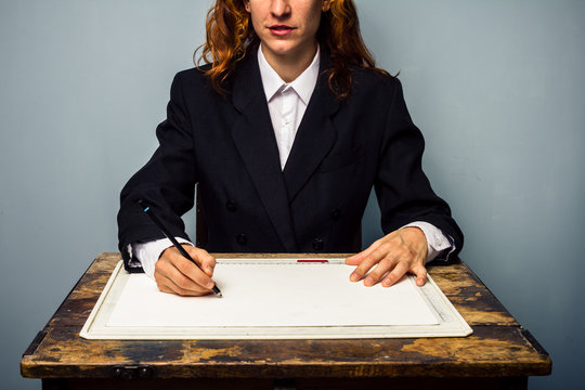 Businesswoman working at drawing board