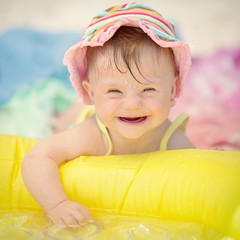 cheerful little baby girl with Downs Syndrome