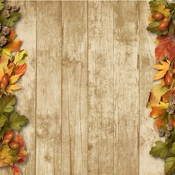 vintage wooden background with autumn leaves