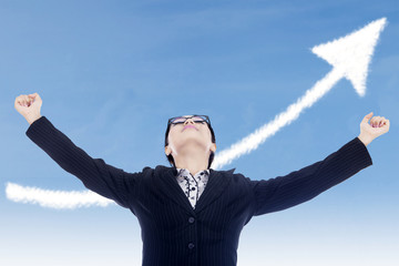Businesswoman success gesture with up arrow cloud