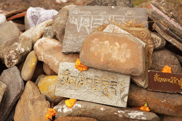 Stones with mantras in the Himalayas - 55410196