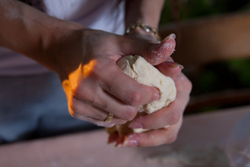 Obraz na płótnie Canvas Female hands in flour