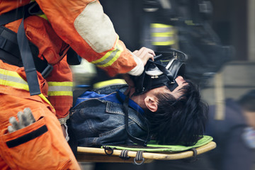 Rescue workers drills move hurt person with a stretcher