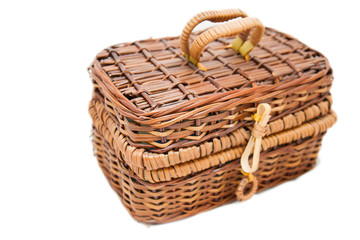 Obraz premium open wicker chest isolated on white background