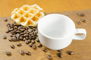 Coffee cup with grains and waffle